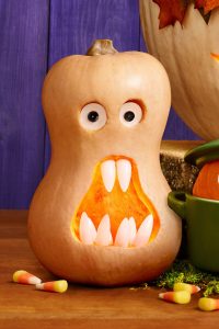 Orange pumpkin with a startled expression, resembling a surprised or shocked face